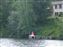 Here's Nancy sitting at the end of our pier. July 4th 2014