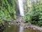 There it is... the Waimoku Falls.  All we need to do is cross this last streem.  As you approach the falls there are two streams you must cross.  This is the second, Nancy stayed back at the first stream.